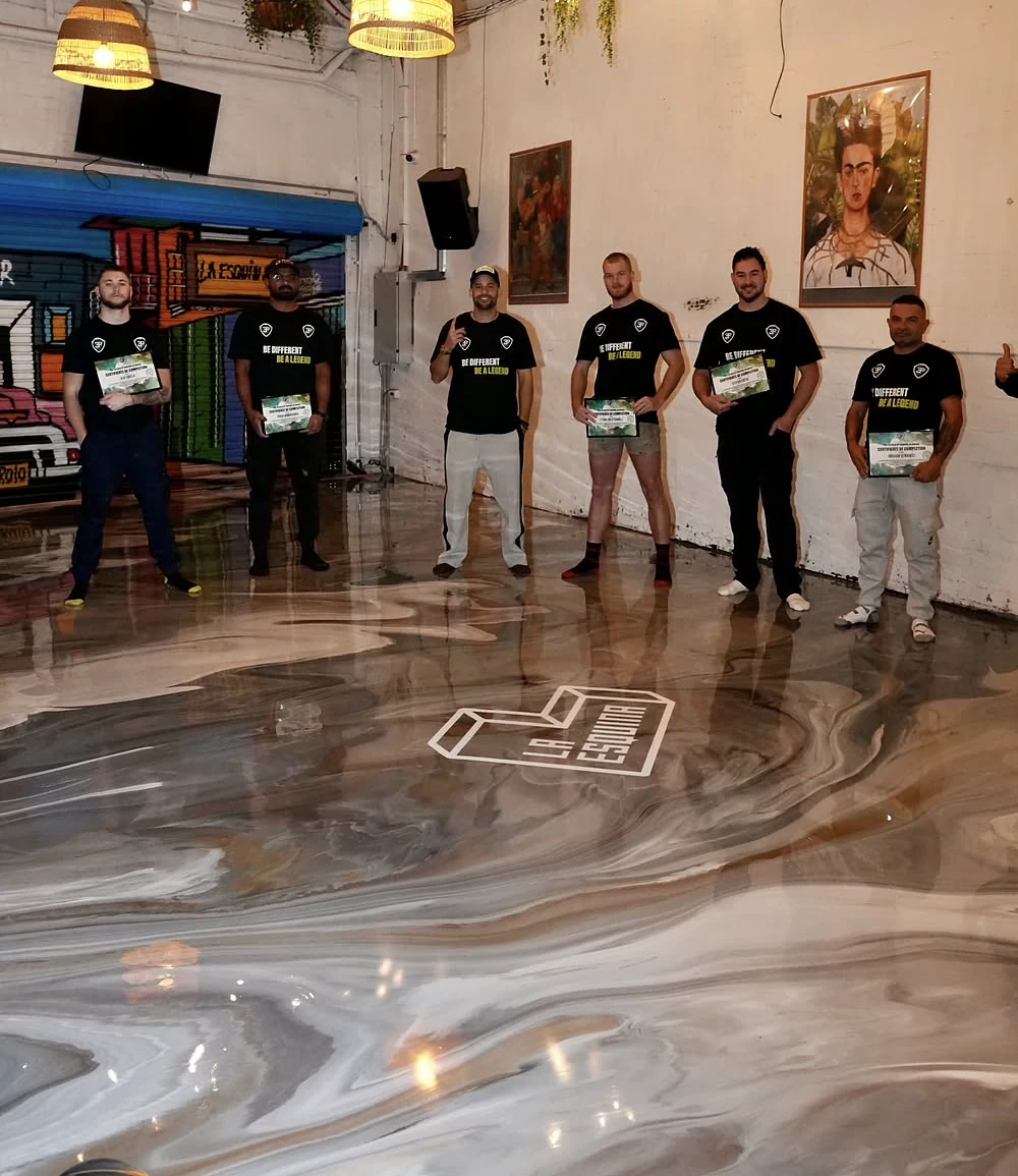 Grind 2 Coat team standing on a completed epoxy floor